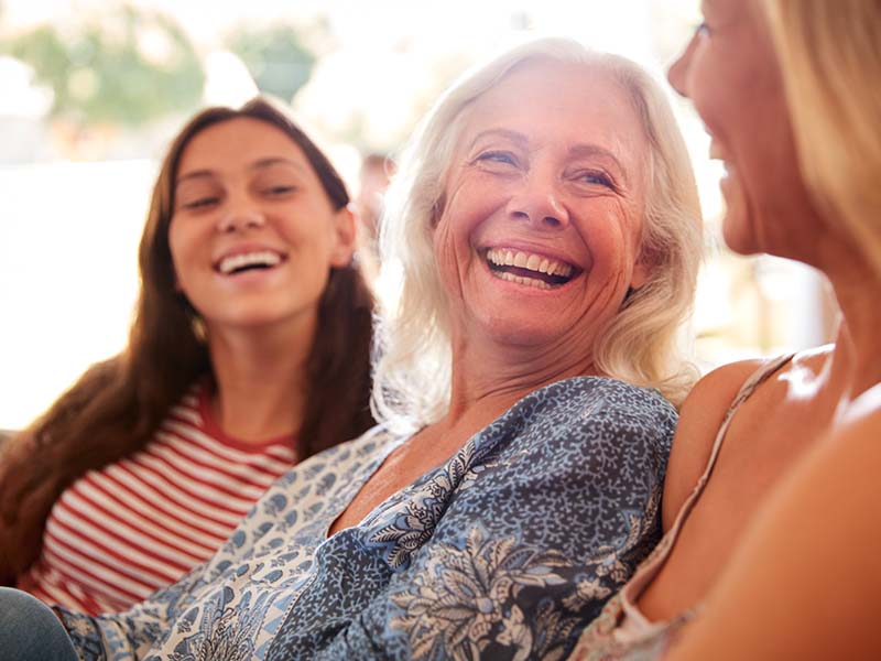 Patients smiling for a general dentistry guide