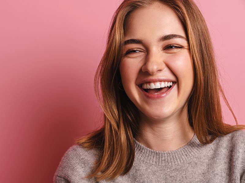 Person smiling for a cosmetic dentistry guide